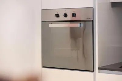 a stainless steel oven in a white kitchen at Island Living in Bluewaters, Close to JBR Beach in Dubai