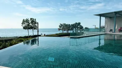 a swimming pool with a view of the ocean at Island Living in Bluewaters, Close to JBR Beach in Dubai