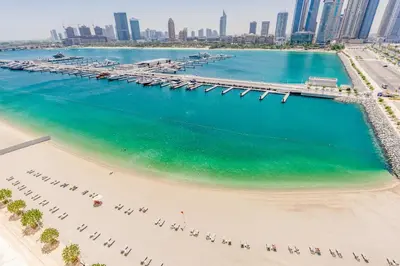 an aerial view of the beach with the dubai skyline at VayK - Elegant 2BR at Emaar Beachfront with Beach Access in Dubai