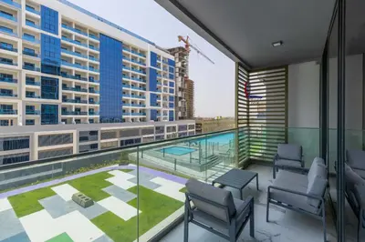 a balcony with a view of a building at VayK - Extra-Large 2BR in Dubai Hills Close to Mall & Park in Dubai
