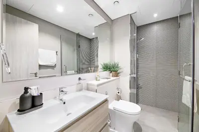 a bathroom with a toilet and a sink and a shower at VayK - Newly Launched 1BR in Business Bay in Dubai