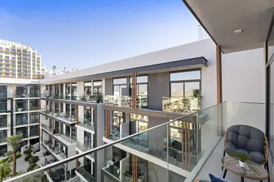 an image of a building with glass balconies at VayK - Contemporary 1BR in a New JVC Community in Dubai