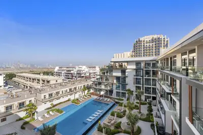 an aerial view of an apartment complex with a swimming pool at VayK - Contemporary 1BR in a New JVC Community in Dubai