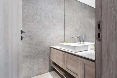 a bathroom with a sink and a mirror at VayK - Contemporary 1BR in a New JVC Community in Dubai