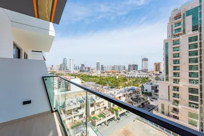a balcony with a view of a city at VayK - Chic 1BR Urban Getaway in Dubai