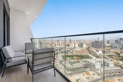 an apartment balcony with a view of a city at VayK - Comfortable 1BR in JVC in Dubai