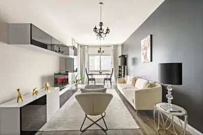 a living room with a couch and a table at VayK - Modern 1BR Near Metro in Dubai Marina in Dubai