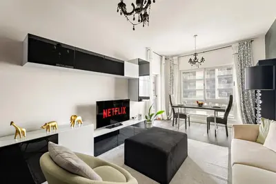 a living room with a couch and a table at VayK - Modern 1BR Near Metro in Dubai Marina in Dubai