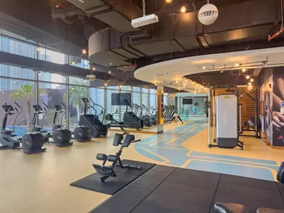 a gym with treadmills and elliptical machines at VayK - Lovely 1BR in Central Dubai Marina in Dubai