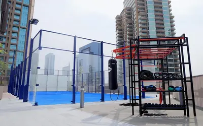a view of a fence and a pool in a city at VayK - Lovely 1BR in Central Dubai Marina in Dubai