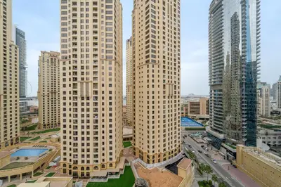 two tall buildings in a city with a street at VayK - Inviting 1BR in Dubai Marina with Stunning Views in Dubai