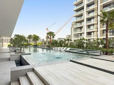 a swimming pool in the middle of a building at VayK - Refined Studio in Dubai Hills with Pool View in Dubai