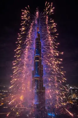a picture of the burj khalifa with fireworks at Signature Luxury Apartments Downtown Dubai in Dubai