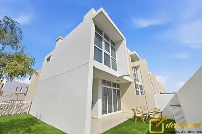 a white house with a green lawn at Contemporary 3-Bedroom Villa by Deleguest in Dubai