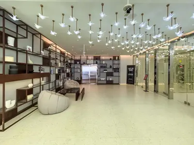 a large room with a couch and a chandelier at Cozy Studio with Balcony I Near Dubai Mall & Downtown in Dubai