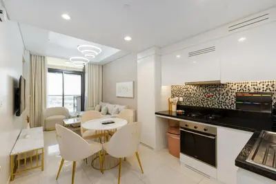 a kitchen and living room with a table and chairs at Aykon City Tower C, Business Bay - Onelink in Dubai