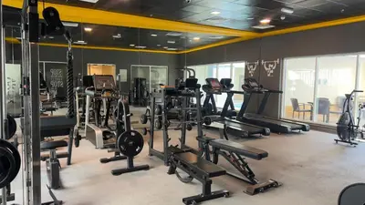 a gym with several treadmills and exercise bikes at Dubai Marina Apartment Steps to DMCC Metro & JBR in Dubai