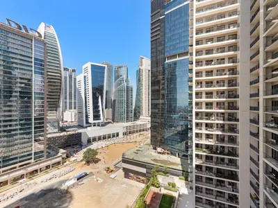 an aerial view of a city with tall buildings at Luxurious 1 BDR Zada Tower Business Bay 12 in Dubai