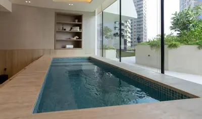 a swimming pool in the middle of a house at Platinum 1BR W Private Pool Binghatti Royale in Dubai