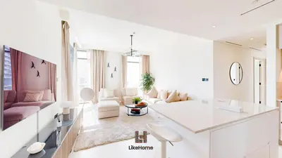 a white living room with a couch and a table at Stunning 2BR Beachfront Living Marina Vista Tower 2 in Dubai