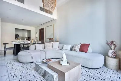a living room with a couch and a table at Frank Porter - J One Tower in Dubai