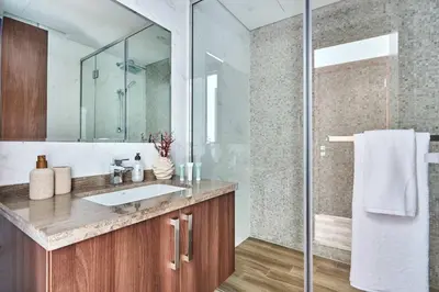 a bathroom with a sink and a shower at Frank Porter - J One Tower in Dubai