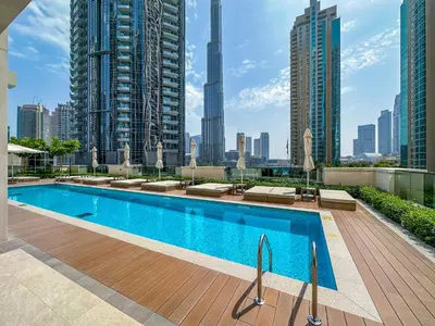 a swimming pool on the roof of a building at One Bedroom Apartment with Balcony in Act One Act Two, Downtown in Dubai