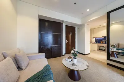 a living room with a couch and a table at Marina View Studio with Balcony in Dubai