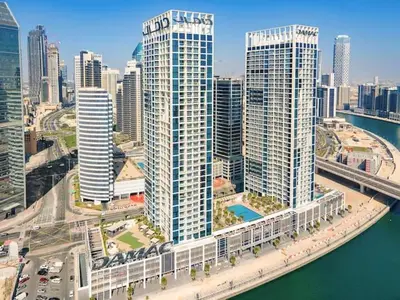 an aerial view of a city with tall buildings at Vogue Business Bay Damac Maison Prive near Burj Khalifa and Dubai Mall, Studio Apartment with Balcony, City and Canal View, Access to all Amenities in Dubai