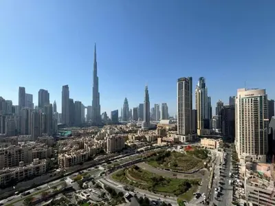 an aerial view of a city with tall buildings at Vogue Business Bay Damac Maison Prive near Burj Khalifa and Dubai Mall, Studio Apartment with Balcony, City and Canal View, Access to all Amenities in Dubai