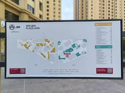 a billboard with a map of the city at ZAH Luxury Holiday Home at JBR,Dubai in Dubai