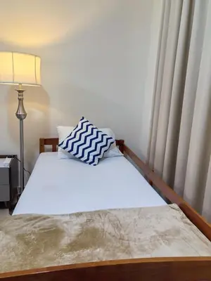 a bed with a pillow on it in a bedroom at ZAH Luxury Holiday Home at JBR,Dubai in Dubai