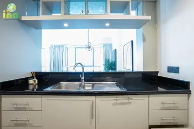 a kitchen with a sink and a window at INA HOMES - Luxury 2 Bedroom Apartment with Full Burj Khalifa & Fountain Views in Dubai