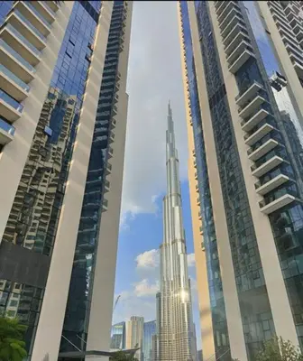 two tall buildings next to each other in a city at Oshima Act Two Downtown 1BR Burj Khalifa in Dubai