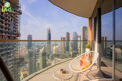 a balcony with a view of a city at INA HOMES - Modren 2 Bedroom Apartment with Full Burj Khalifa View in Dubai