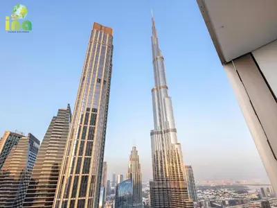 a group of tall buildings in a city at INA HOMES - Modren 2 Bedroom Apartment with Full Burj Khalifa View in Dubai