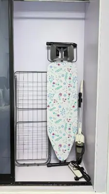 a tie is hanging on a rack in a drawer at Studio in central location near the Metro in Dubai