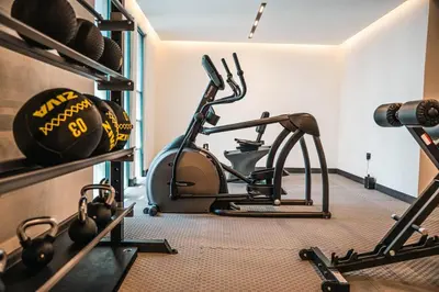 a room with a gym with a treadmill at Studio in central location near the Metro in Dubai