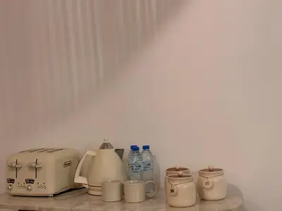 a counter with a toaster and other appliances on it at Dubai Escape Private Pool and Parking in Dubai