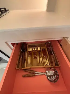 a drawer full of utensils in a box with a spoon at Dubai Escape Private Pool and Parking in Dubai