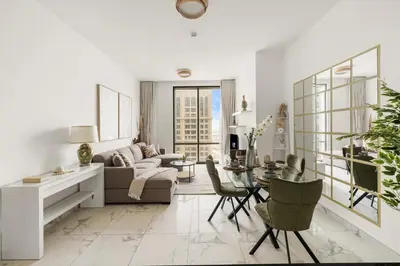a living room with a couch and a table at Stunning 1BR at Noora Tower, Al Habtoor City in Dubai