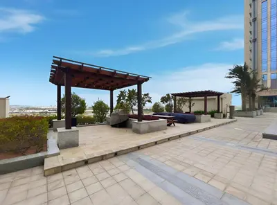a pavilion with a picnic table and a pavillion at Stunning 1BR at Noora Tower, Al Habtoor City in Dubai