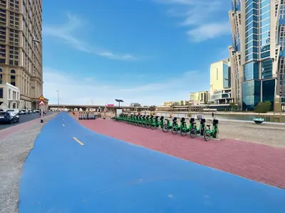 a group of people on bikes on a street at Stunning 1BR at Noora Tower, Al Habtoor City in Dubai