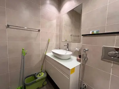 a bathroom with a sink and a mirror at Modern 1BR Apartment Golf View Gym Pool in Dubai