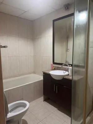 a bathroom with a toilet and a sink and a tub at Luxury Entire 3 bed rooms with 3 bathrooms in Dubai