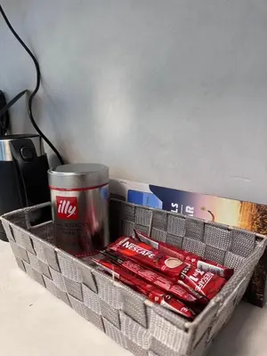 a basket with a drink and a can of coke at Marina Beach JBR 1BR Apartment in Dubai Marina in Dubai