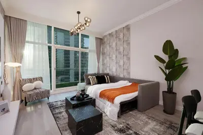 a bedroom with a bed and a large window at Coastal Elegance with PlayRoom PS5, 4BHK front JBR Beach Sleep 14 pax in Dubai