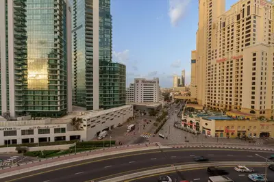 a view of a city with tall buildings and a street at Coastal Elegance with PlayRoom PS5, 4BHK front JBR Beach Sleep 14 pax in Dubai