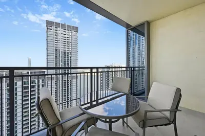 a balcony with a table and chairs and a view at Creek Rise Tower 2 - 1BR with Creek Views, Panoramic Living, Dubai Creek Harbour in Dubai
