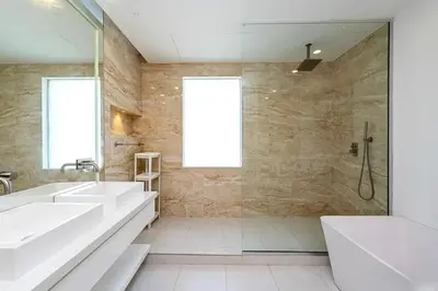a bathroom with two sinks and a shower at Luxurious 4 Bedroom Villa In Emirates Hills in Dubai